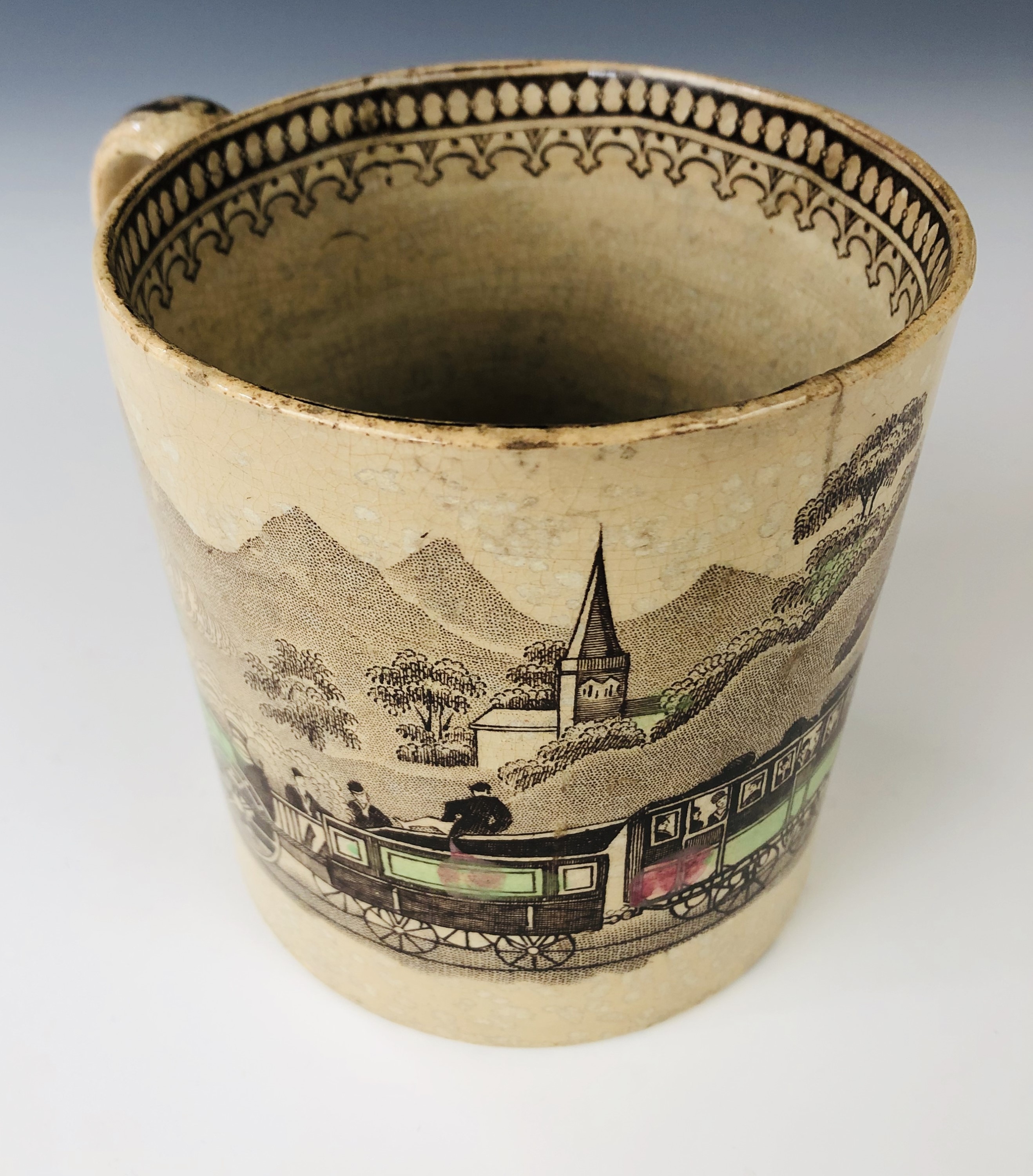 A mid 19th century Staffordshire pottery railway pattern mug, decorated in the round with a - Image 3 of 3