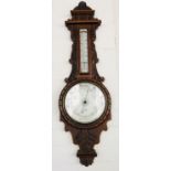 A Victorian carved walnut banjo barometer
