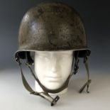 A Second World War US Army helmet for paratroop use