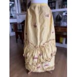 An 18th Century lady's lemon-yellow silk underskirt, possibly Spitalfields, to be worn with a robe a