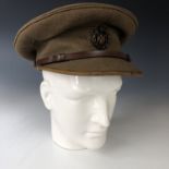 A Great War army officer's Service Dress cap by Cater & Co of Pall Mall, the peak trimmed in