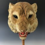 A Victorian candle-illuminated toy, comprising a pair of adorsed mache or composition masks