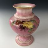 A Victorian Royal Worcester shouldered vase, hand-enamelled in depiction of strawflowers over a pink
