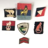 A small quantity of Second World War and later British Army cloth insignia