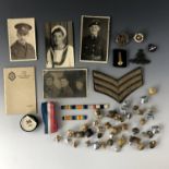 Sundry items of military insignia, medal ribbons, postcards etc