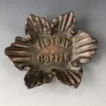 A small dish cast from copper salvaged from Lord Nelson's flagship HMS Victory, circa 1905