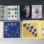 Four various commemorative coin packs