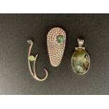 Three contemporary silver / white metal (tests as silver) and green stone pendants, 21.3g