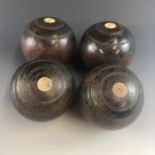 Four vintage crown green bowls