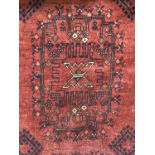 An oriental rug, 307 x 210 cm