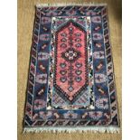 An oriental rug, 200 x 122 cm