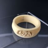 An early 20th Century Canton / Chinese carved ivory napkin ring