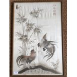 A Chinese silkwork picture depicting two cockerels fighting, framed and mounted under glass, 68 x 46