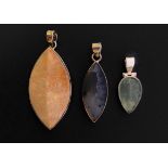 Three contemporary silver / white metal (tests as silver) and polished stone pendants, including a