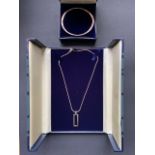 A contemporary Beaverbrook Modernist silver pendant necklace and bangle in original packaging