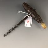 A late Georgian turned rosewood handled corkscrew