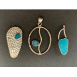 Three contemporary silver / white metal (tests as silver) and blue stone pendants, including a druse