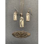 A Charles Rennie Mackintosh style white metal (tested as silver) pendant necklace and earrings,