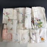 A quantity of vintage hand-embroidered table linens