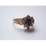 A 9ct gold, cubic zirconia and blue stone flower-head dress ring, 2.1g, K