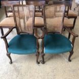 A pair of George V cane-backed open armchairs