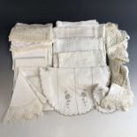 A quantity of vintage whitework table linens