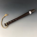 A vintage wooden police truncheon