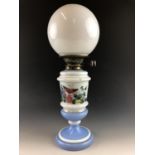 A Victorian hand-enamelled glass oil lamp