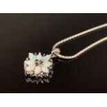A contemporary 9ct white gold, opal and sapphire flower head cluster pendant on a snake-link neck