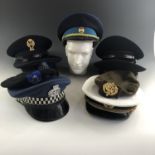 A quantity of post-War foreign police caps