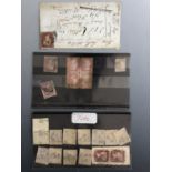 A quantity of QV Penny Red postage stamps, including an imperforate, an imperforate on cover, and