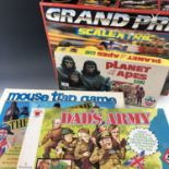 A Scalextric Grand Prix slot car racing set, together with Dad's Army, Planet of the Apes and