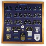 A mounted display of post-War German Police / Deutsche Polizei badges
