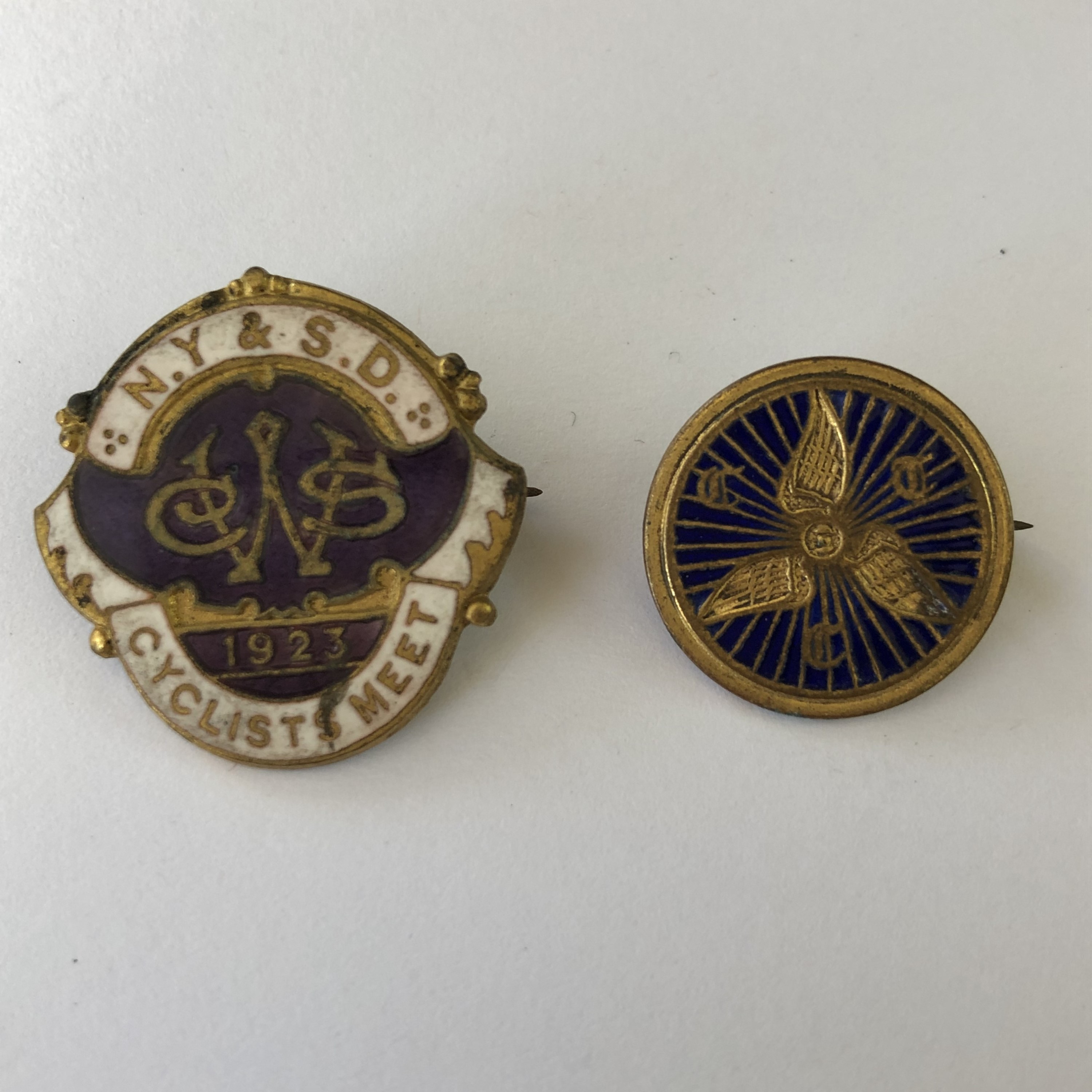 A 1923 "Cyclist Meet" enamelled lapel badge and one other early 20th Century bicycle association