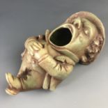 A late 19th Century novelty porcelain figural dish modelled as a slumbering gentleman with open