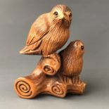 A Japanese carved wood netsuke modelled as a bird and chick