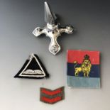 Sundry military badges and a helmet spike