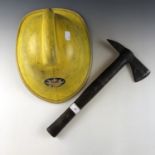 A London fire brigade helmet and axe