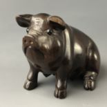 A Japanese carved wood netsuke modelled as a pig