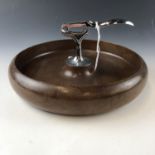 A mid century turned wooden nut bowl with integral cracker