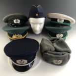 A quantity of East German Police / Volkspolizei caps
