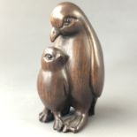 A Japanese carved wood netsuke modelled as penguins