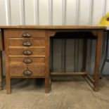 An oak office desk, circa 1930's - 1950's, 130 x 60 x 80 cm