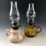 Two Victorian finger oil lamps having glass reservoirs