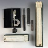 Two slide rules, two steel pocket folding rules, a loupe, micrometer and Philips Electrical Ltd (