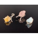 Three contemporary white metal (tests as silver) and rough cut gemstone pendants, including rose