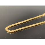 A yellow-metal rope-link bracelet, stamped '9K', 3.8g