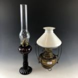 A Victorian pendant oil lamp with milk glass shade, together with one other oil lamp