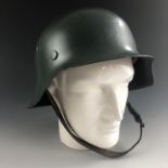 A post-War German Bavarian steel helmet of M'42 form