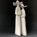 A Lladro figurine of two nuns